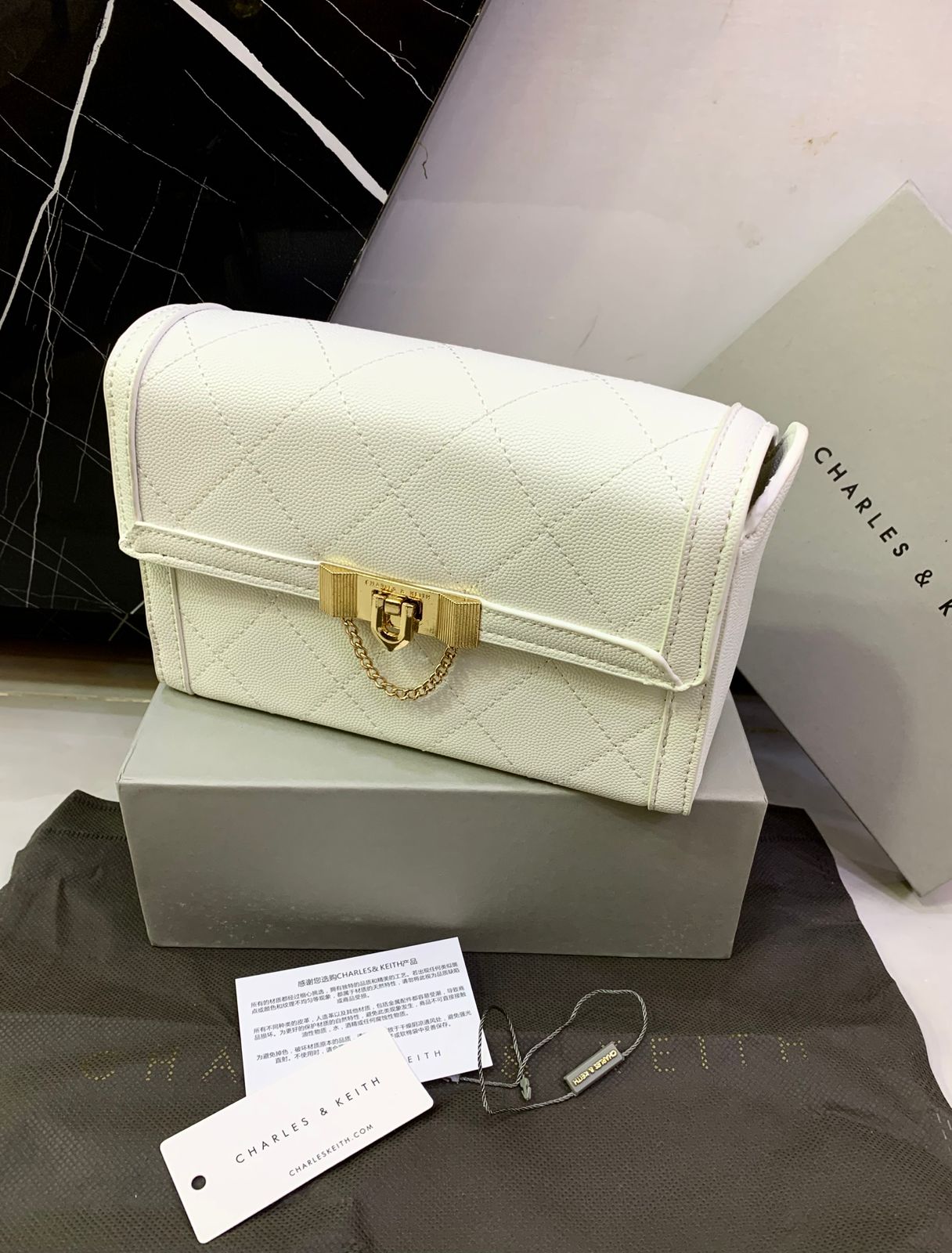 Charles & Keith Tallulah Quilted Push Lock Clutch