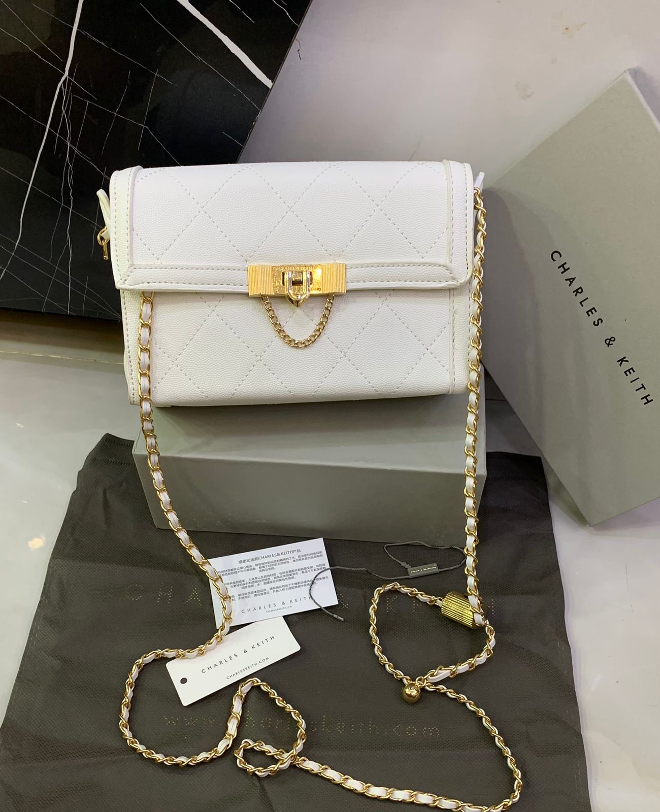 Charles & Keith Tallulah Quilted Push Lock Clutch